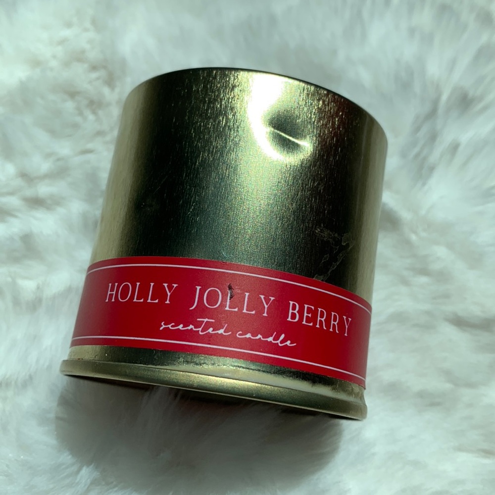 Never used, Holly Jolly Berry candle in a gold tin